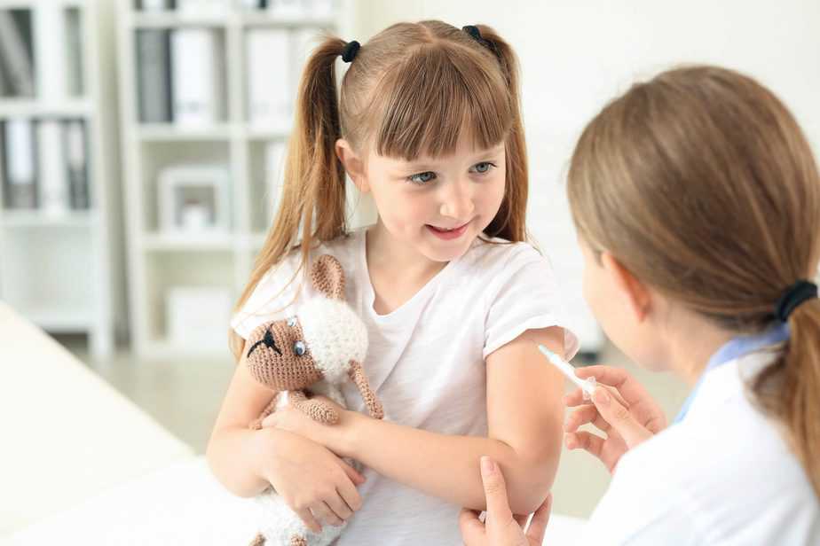 girl receiving a flu shot